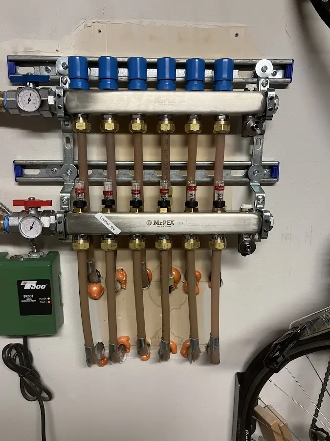 Plumber performing Leak Detection at a residential property in New Palestine